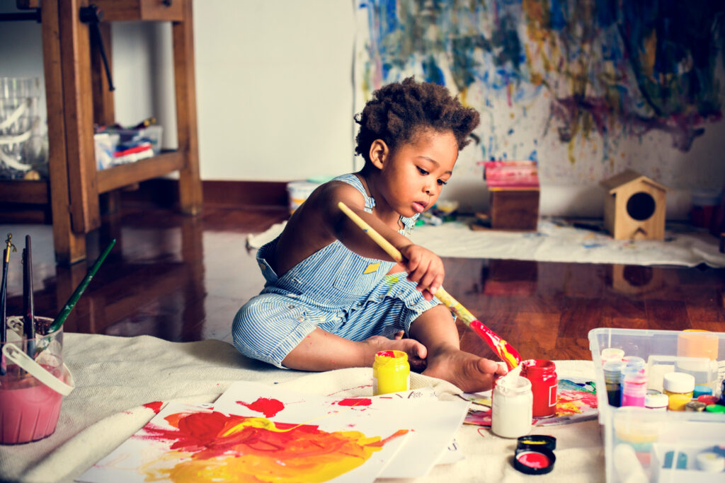 child painting indoors