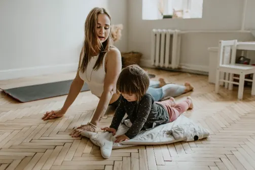 Mother and child doing a rainy day activity...yoga