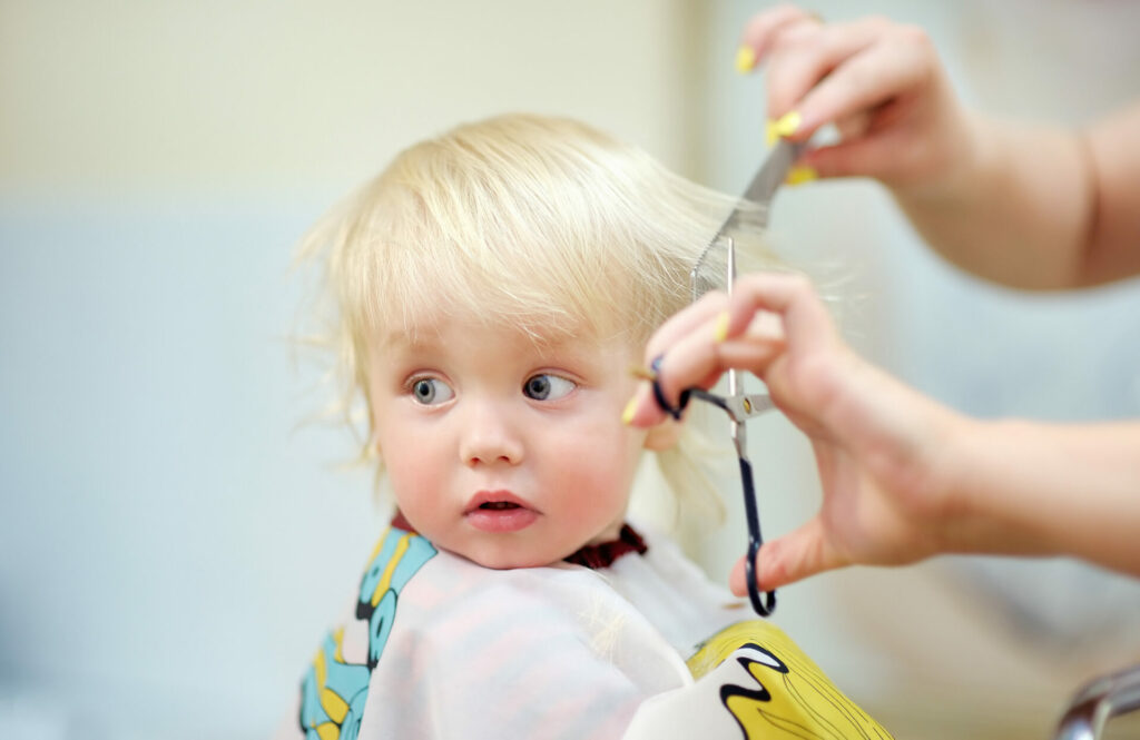 image of toddler getting haircut for how can i keep my toddler busy for a haircut post.