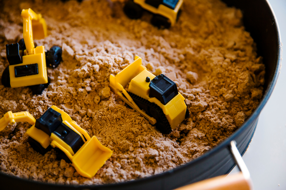 Image of construction-themed sensory bin, a morning activities for toddlers and preschoolers.