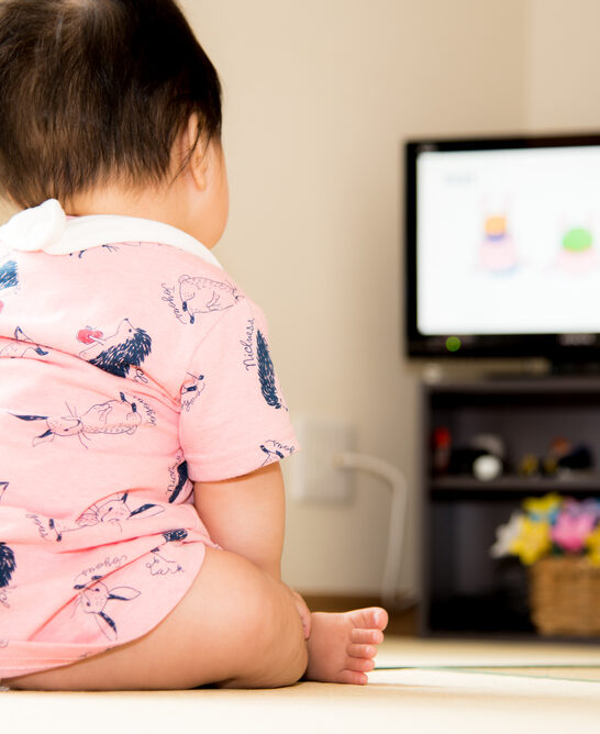 Image of baby watching TV, in need of a way to entertain baby without a TV.